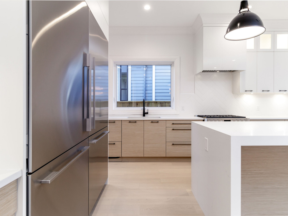 Example of a transitional kitchen design in Vancouver
