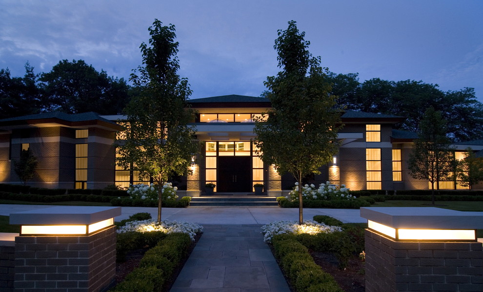 Design ideas for a contemporary two-storey exterior in Detroit.