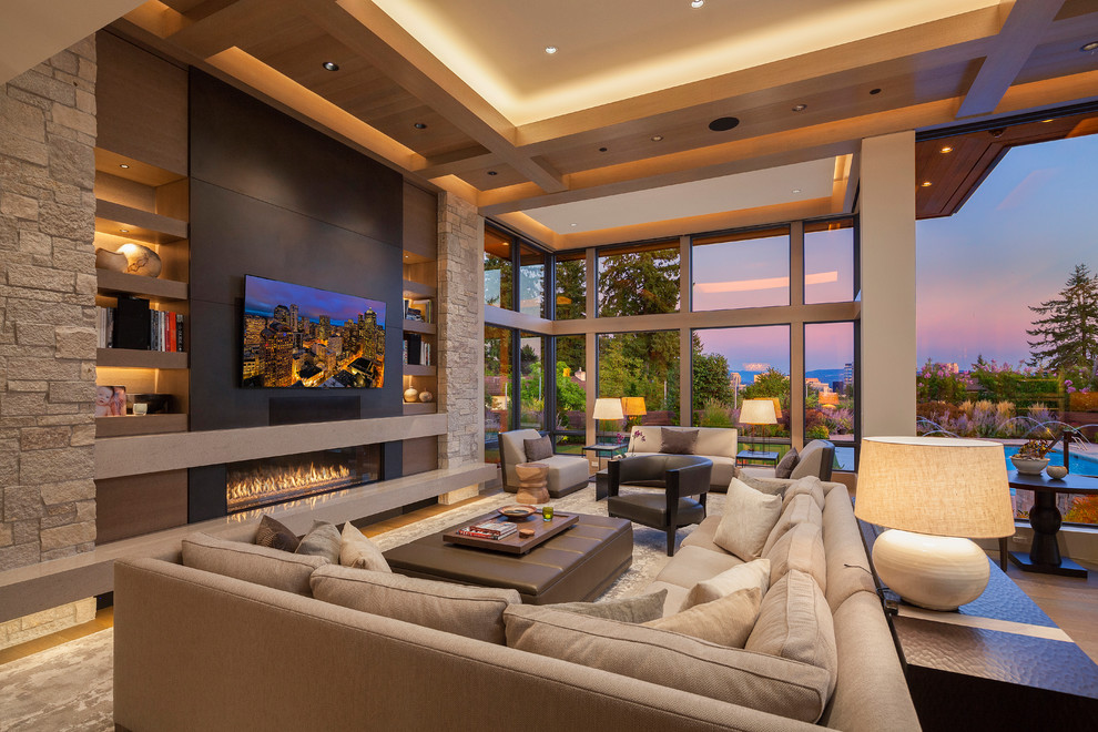 Trendy open concept family room photo with a ribbon fireplace and a wall-mounted tv