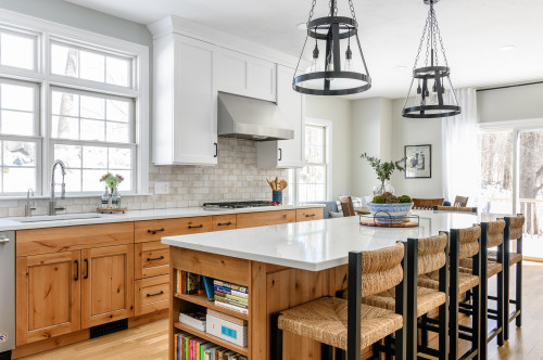 Modern kitchen cabinets with natural wood finish and white upper cabinets for a bright open space