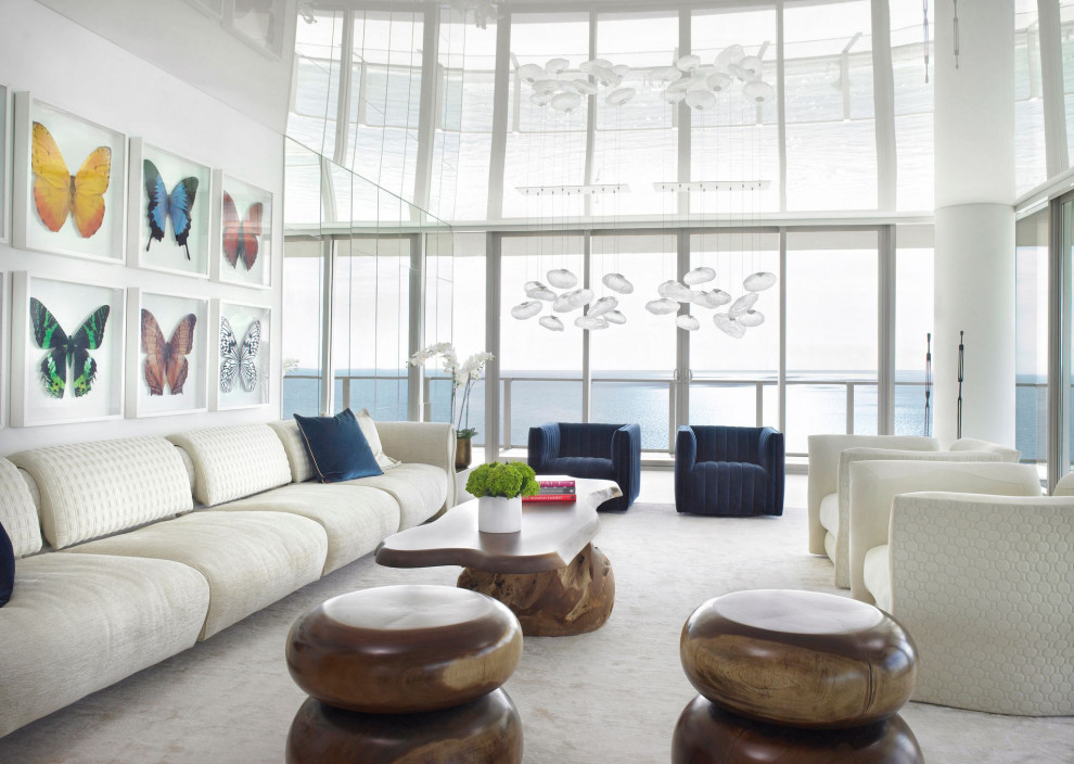 Large contemporary formal open concept living room in Miami with white walls.