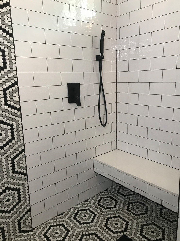 Photo of a large transitional master bathroom in Philadelphia with shaker cabinets, grey cabinets, a double shower, a one-piece toilet, white tile, ceramic tile, grey walls, vinyl floors, an undermount sink, engineered quartz benchtops, brown floor, a hinged shower door and multi-coloured benchtops.