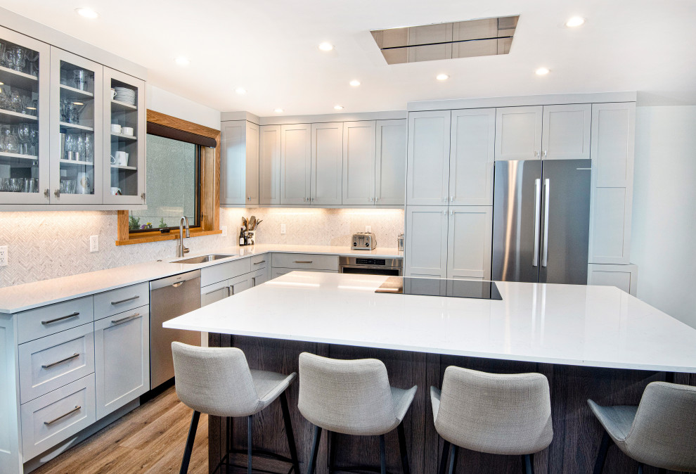 Example of a transitional kitchen design in Denver