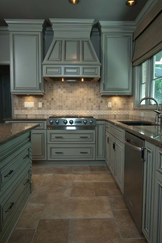 Small l-shaped ceramic tile eat-in kitchen photo with a single-bowl sink, flat-panel cabinets, gray cabinets, stainless steel appliances and granite countertops