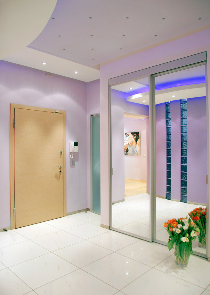 Mid-sized contemporary foyer in Moscow with blue walls, porcelain floors, a single front door and a metal front door.