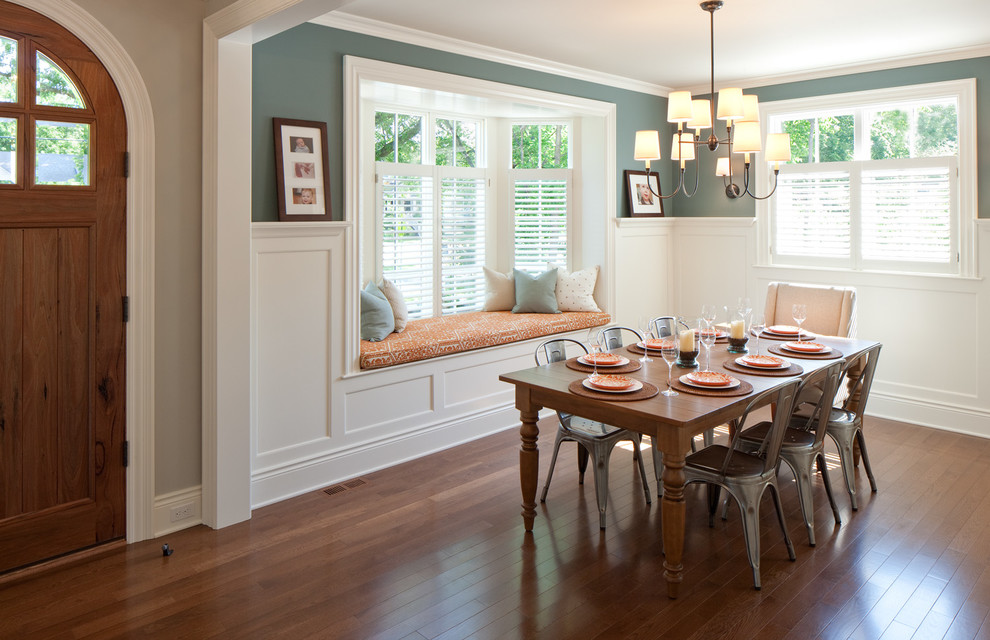 Design ideas for a traditional dining room in Grand Rapids with dark hardwood floors and green walls.