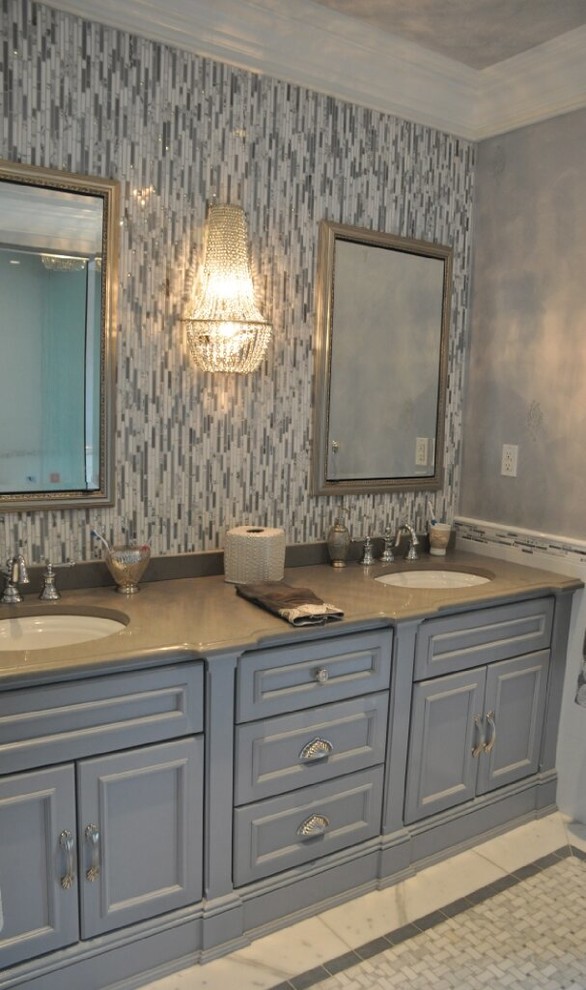 Large transitional master bathroom in New York with an undermount sink, recessed-panel cabinets, grey cabinets, marble benchtops, a freestanding tub, an alcove shower, a two-piece toilet, gray tile, mosaic tile, grey walls and mosaic tile floors.