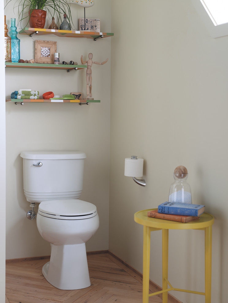 Bathroom - small eclectic kids' medium tone wood floor bathroom idea in Milwaukee with a two-piece toilet and beige walls