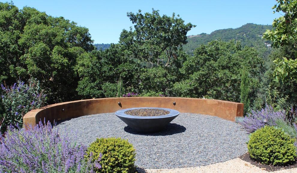 Design ideas for a large modern backyard full sun garden in San Francisco with a fire feature and gravel.