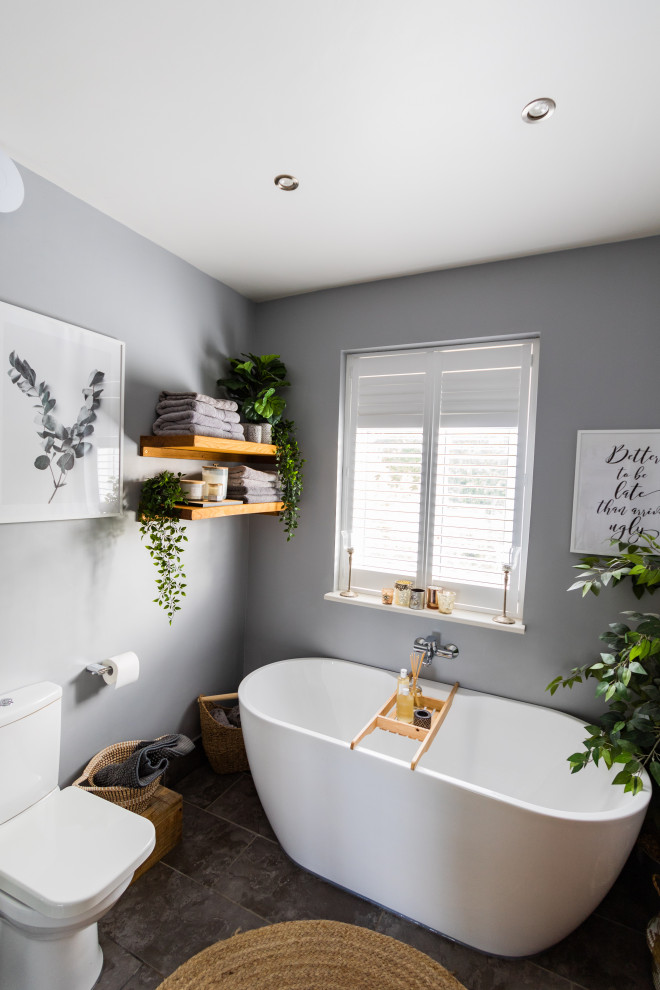 Inspiration for a small contemporary kids bathroom in Buckinghamshire with medium wood cabinets, a corner shower, black and white tile, grey walls, slate floors, grey floor, a hinged shower door, a single vanity and a freestanding vanity.