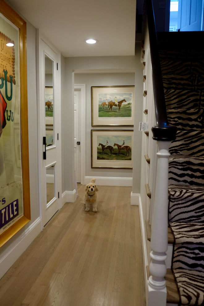 Entryway - mid-sized transitional light wood floor and beige floor entryway idea in Boston with white walls