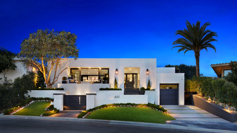 Inspiration for a transitional one-storey white house exterior in Los Angeles with a flat roof.