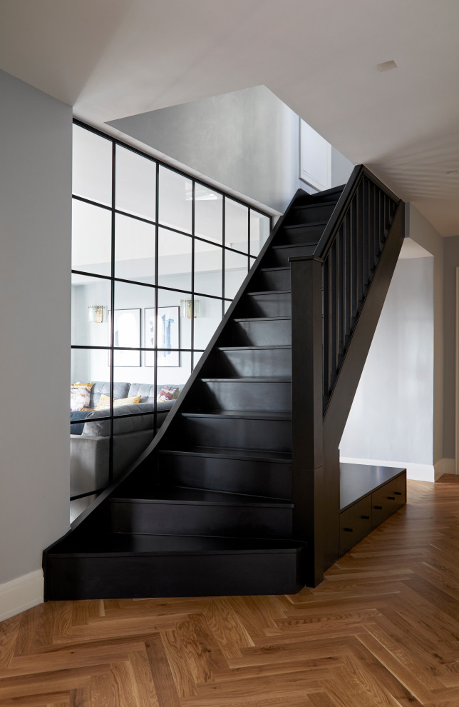 This is an example of a mid-sized contemporary staircase in London.
