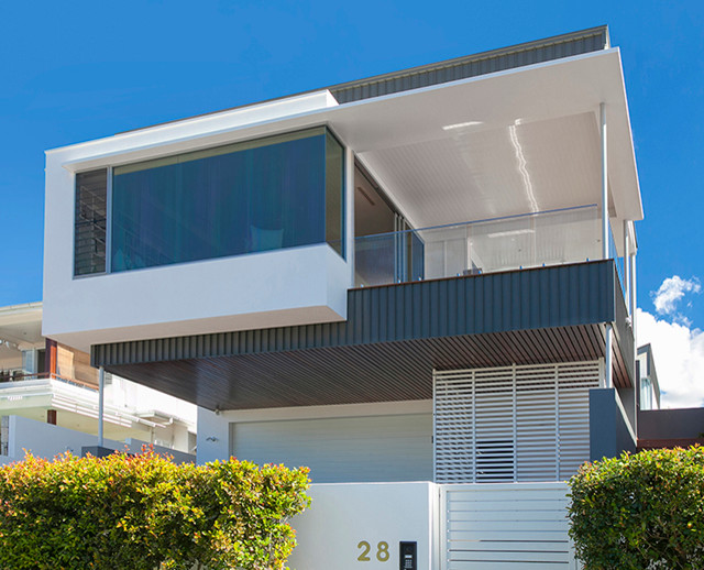 Photo of a small contemporary two-storey exterior in Sunshine Coast.