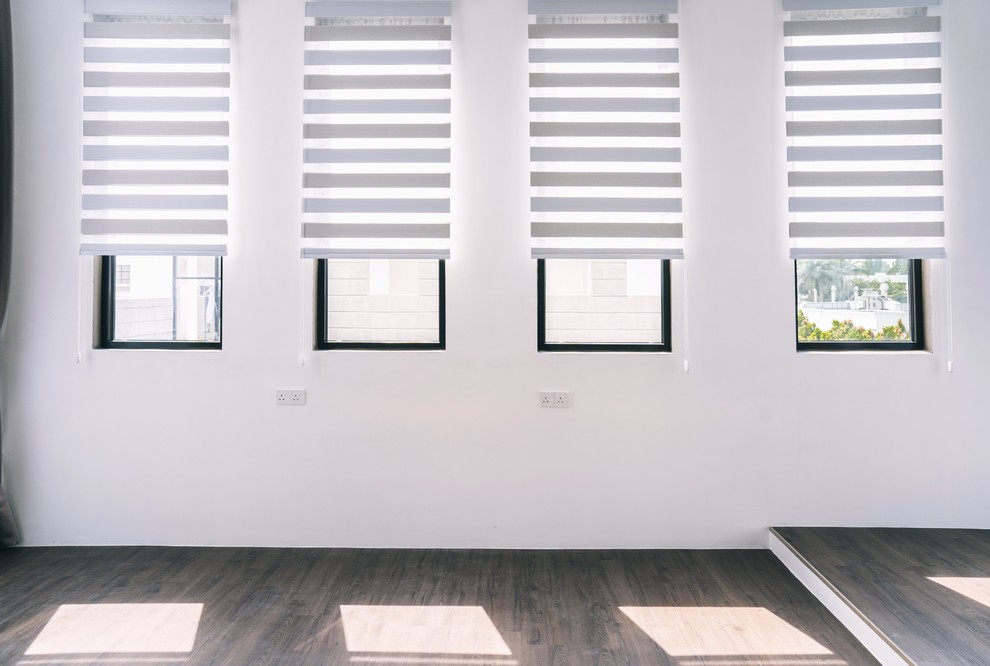 Home design - modern medium tone wood floor and brown floor home design idea with white walls