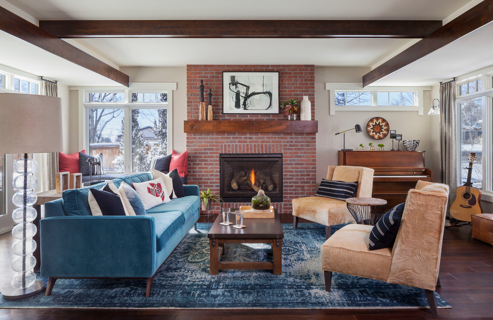 Photo of a mid-sized transitional living room in Denver with a music area, grey walls, dark hardwood floors, a standard fireplace, a brick fireplace surround and no tv.