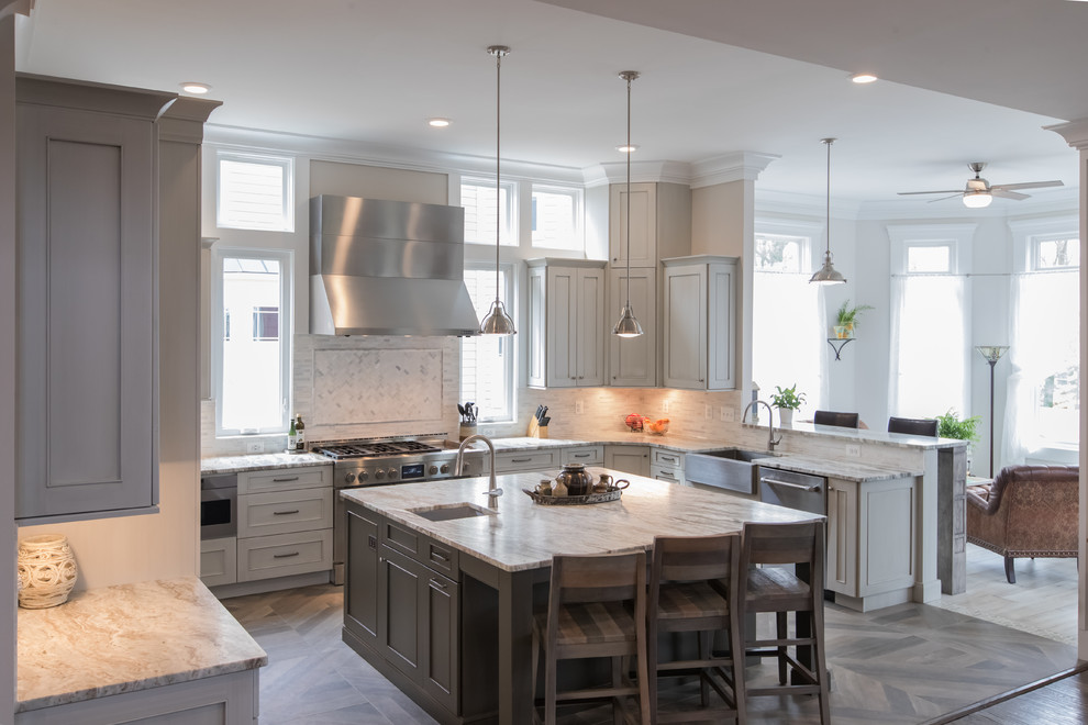 Inspiration for a large country u-shaped open plan kitchen in DC Metro with a farmhouse sink, shaker cabinets, grey cabinets, granite benchtops, grey splashback, glass tile splashback, stainless steel appliances, ceramic floors, with island, grey floor and grey benchtop.