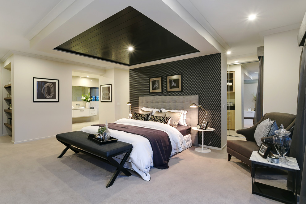 Photo of a large traditional bedroom in Melbourne with carpet.
