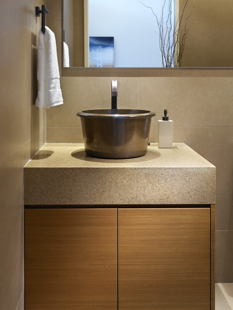 Design ideas for a contemporary powder room in Vancouver with a vessel sink and grey benchtops.