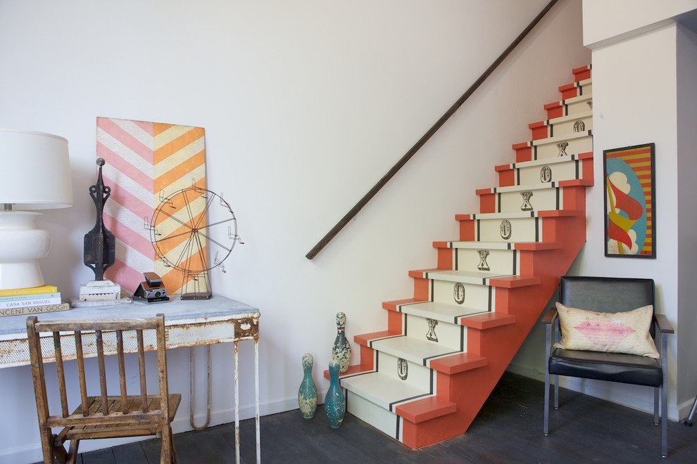 Inspiration for an eclectic painted wood straight staircase in San Francisco with painted wood risers.
