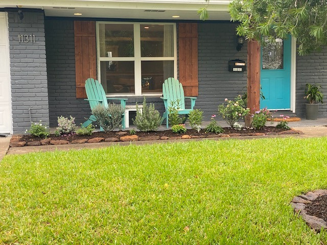 Backyard flagstone walking path with firepit and seating area
