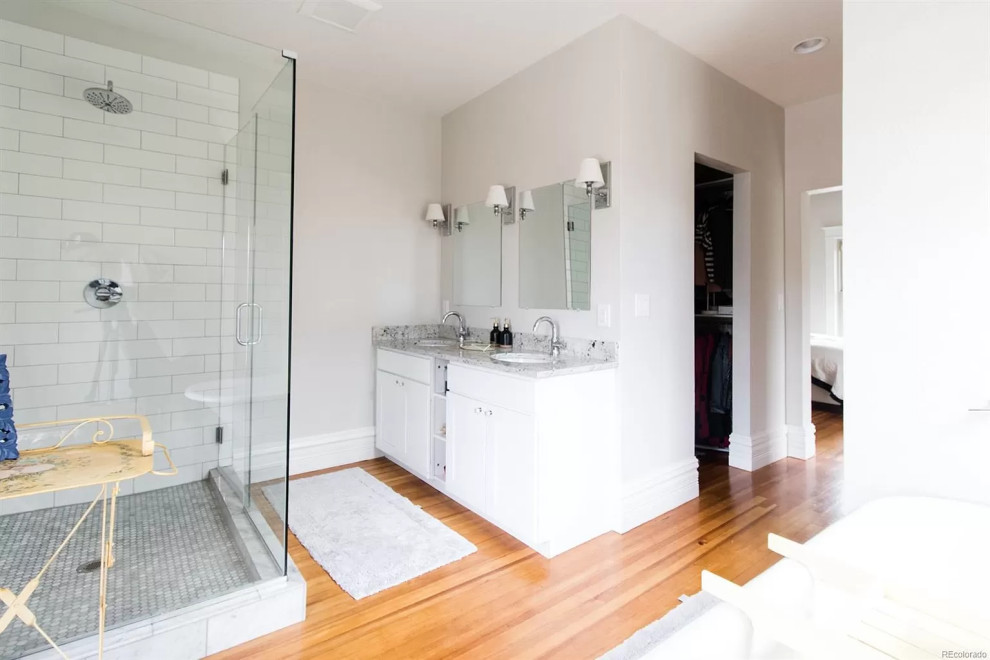 Inspiration for a mid-sized rustic master white tile and ceramic tile double-sink bathroom remodel in Denver with white cabinets, a hinged shower door and a built-in vanity