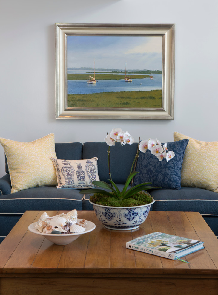 Photo of a mid-sized beach style enclosed living room in Boston with white walls, no fireplace and no tv.