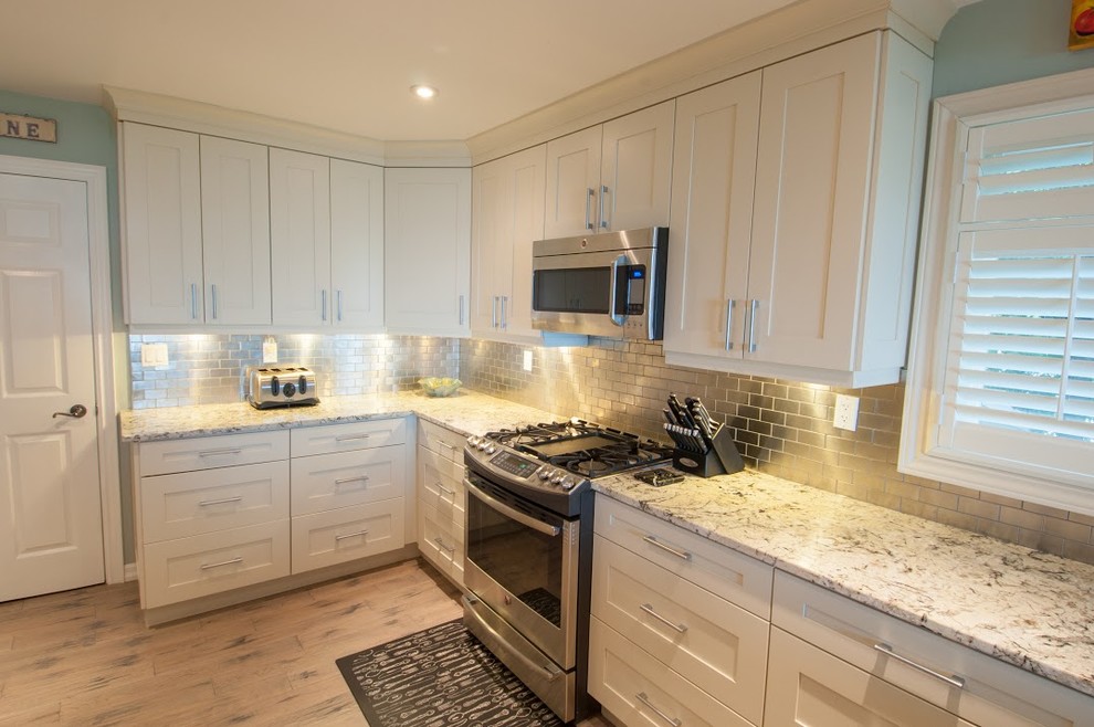 Example of a transitional kitchen design in Toronto
