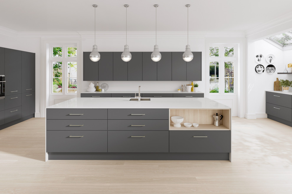 Large contemporary u-shaped open plan kitchen in Oxfordshire with a single-bowl sink, flat-panel cabinets, grey cabinets, copper benchtops, white splashback, black appliances, with island, beige floor and white benchtop.
