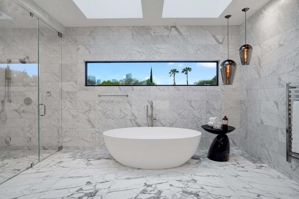 Inspiration for a huge modern master white tile and porcelain tile double-sink, coffered ceiling, porcelain tile and white floor bathroom remodel in San Diego with flat-panel cabinets, medium tone wood cabinets, white walls, an undermount sink, solid surface countertops, a hinged shower door, white countertops and a floating vanity