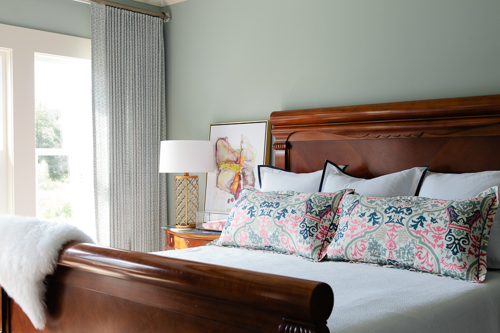 Example of a mid-sized beach style master carpeted bedroom design with blue walls