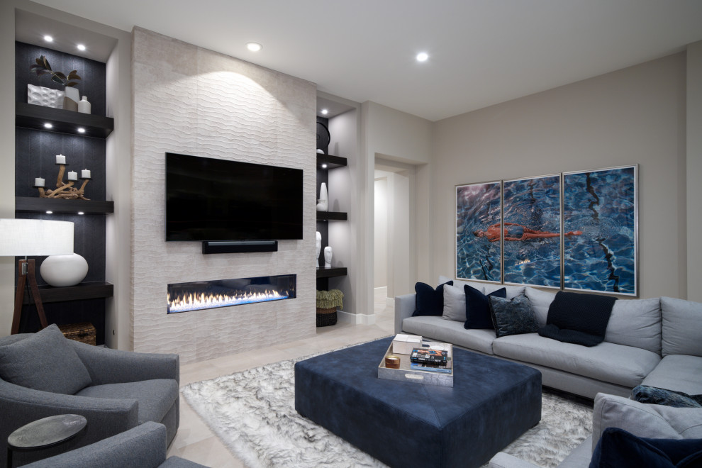 Inspiration for a mid-sized transitional open concept family room in Other with grey walls, porcelain floors, a standard fireplace, a tile fireplace surround, a wall-mounted tv, grey floor and wallpaper.