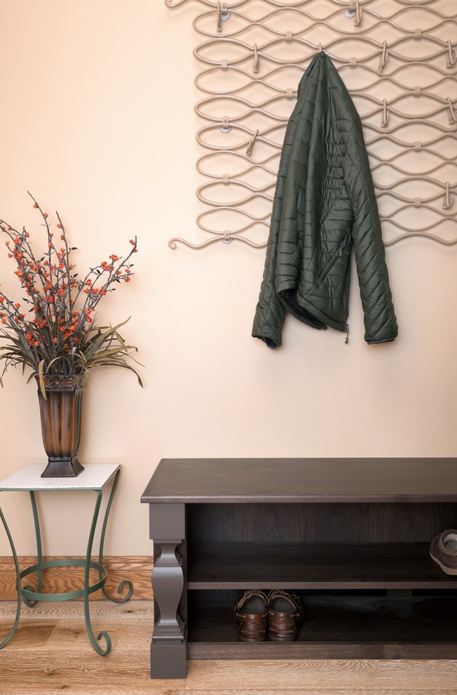 Mid-sized transitional light wood floor and beige floor hallway photo with beige walls