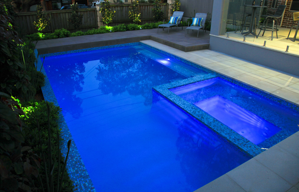Inspiration for a mid-sized contemporary backyard rectangular lap pool in Sydney with a hot tub and concrete pavers.