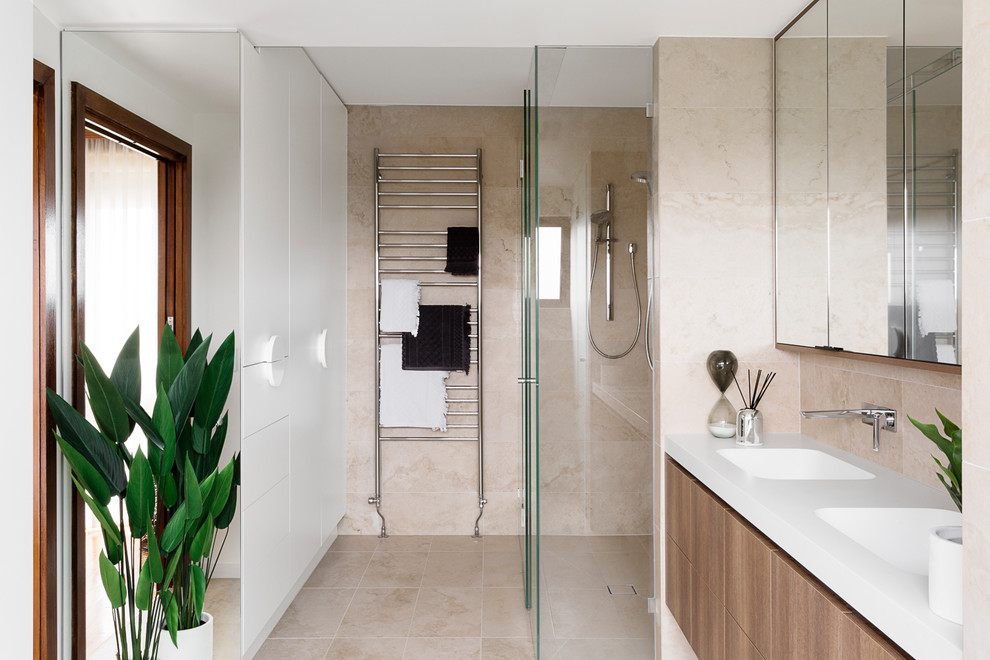This is an example of a mid-sized traditional master bathroom in Melbourne with flat-panel cabinets, dark wood cabinets, a drop-in tub, an alcove shower, a two-piece toilet, ceramic tile, white walls, ceramic floors, a drop-in sink, laminate benchtops, multi-coloured floor, an open shower and white benchtops.