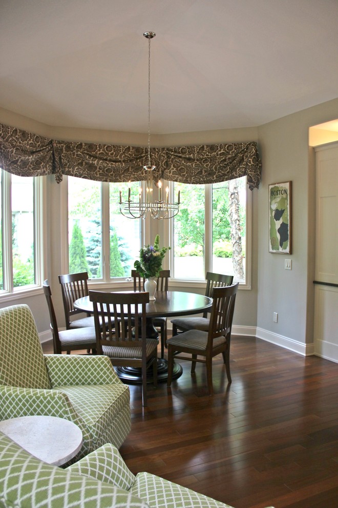 Mid-sized transitional l-shaped dark wood floor kitchen/dining room combo photo with a double-bowl sink, shaker cabinets, white cabinets, granite countertops, white backsplash, glass tile backsplash, stainless steel appliances and an island