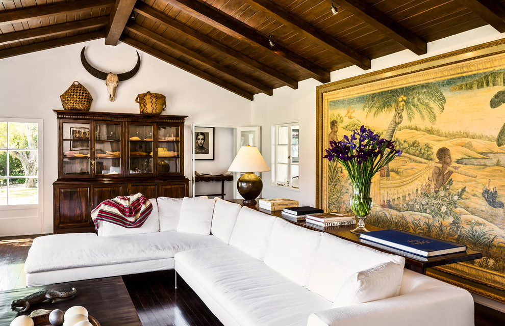 Photo of a large mediterranean open concept family room in Santa Barbara with white walls and dark hardwood floors.