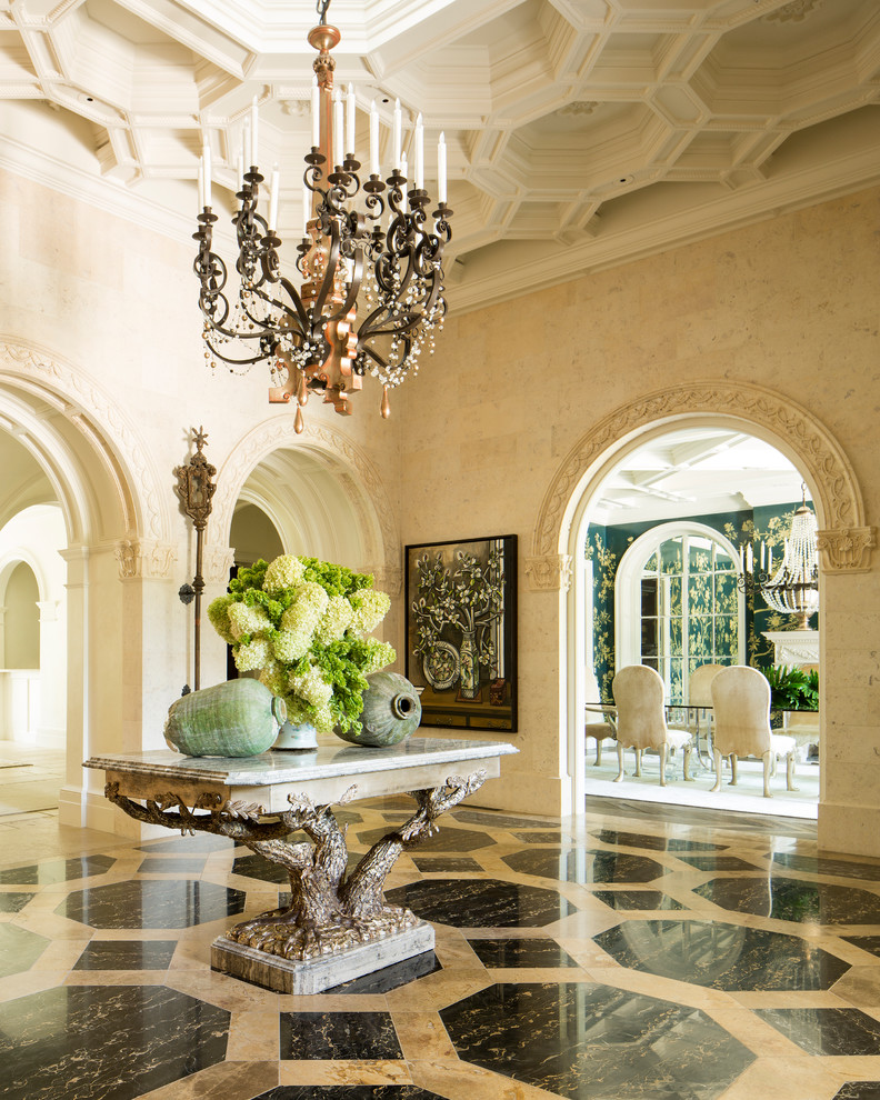 Photo of a mediterranean foyer in Dallas with beige walls and multi-coloured floor.