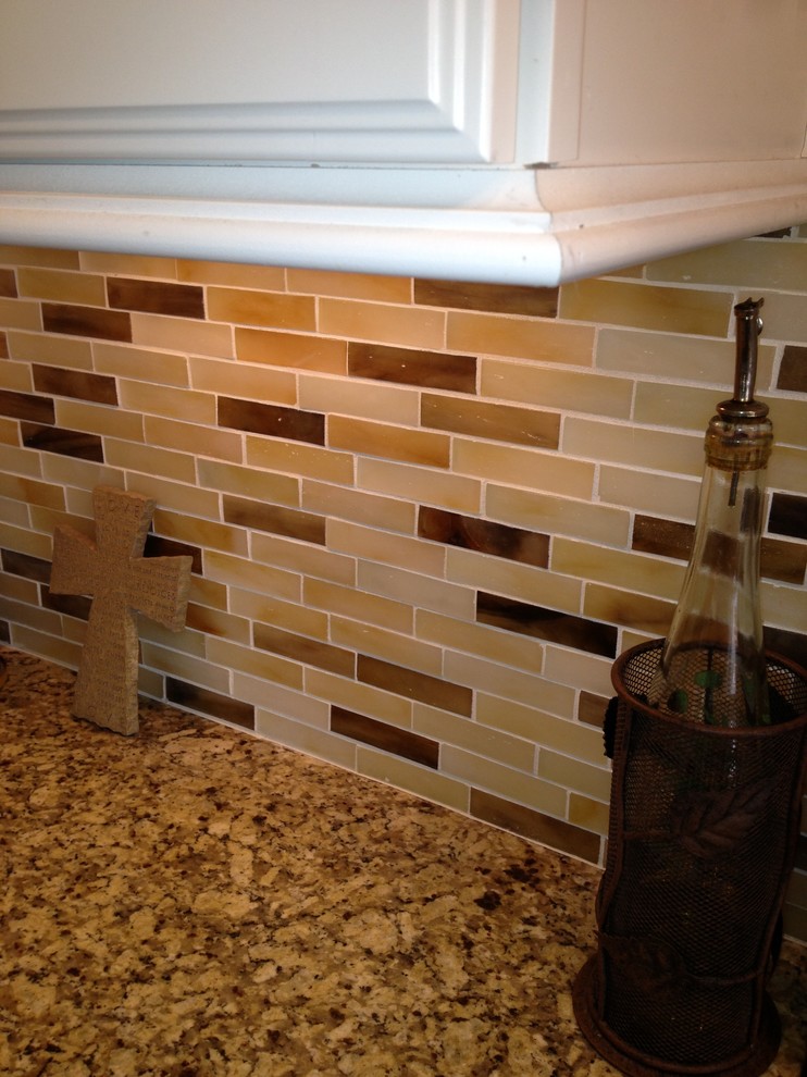 Example of a transitional kitchen design in Denver
