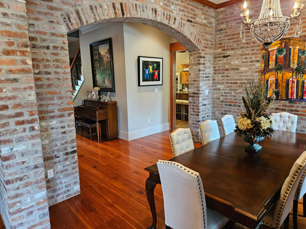 Design ideas for a dining room in New Orleans with medium hardwood floors.