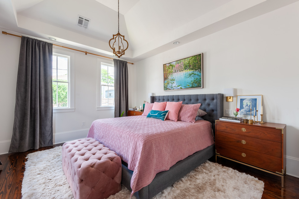 Mid-sized transitional master bedroom in New Orleans with white walls, dark hardwood floors, no fireplace and brown floor.