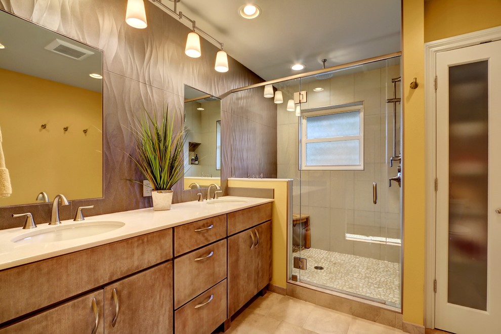 Inspiration for a mid-sized contemporary master bathroom in Seattle with flat-panel cabinets, medium wood cabinets, an alcove tub, an alcove shower, a two-piece toilet, gray tile, porcelain tile, yellow walls, an undermount sink and engineered quartz benchtops.
