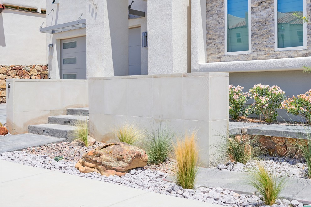Inspiration for a small drought-tolerant front yard concrete paver garden path.