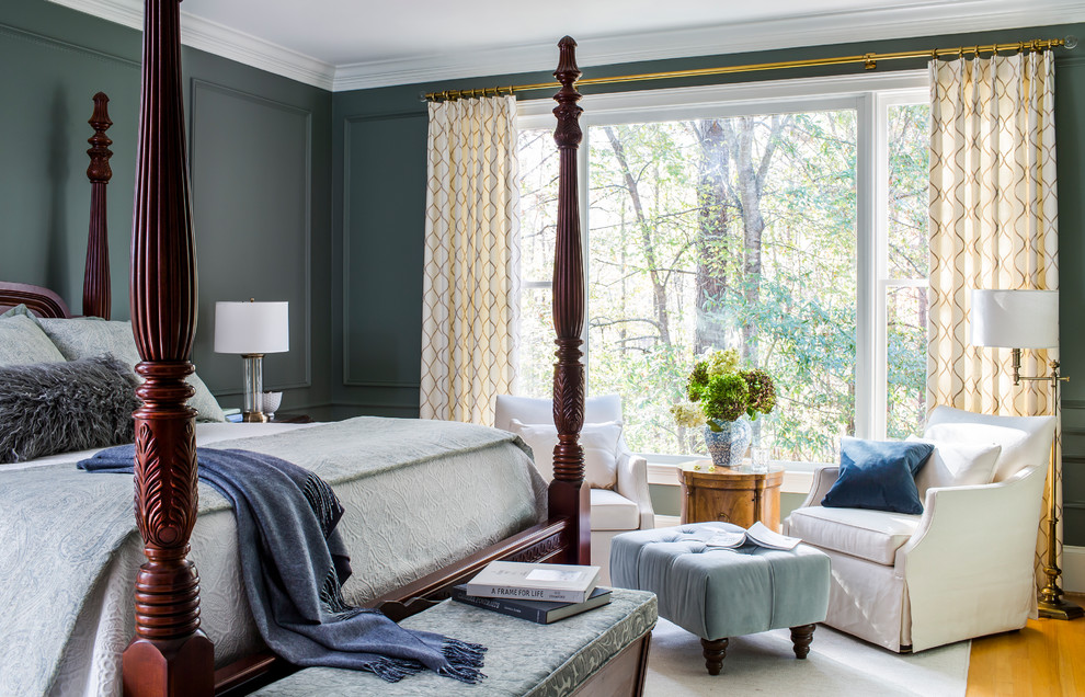 Inspiration for a traditional master bedroom in Atlanta with green walls and medium hardwood floors.