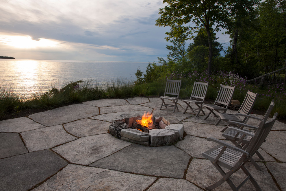 Patio - large rustic backyard stone full sun patio idea for summer