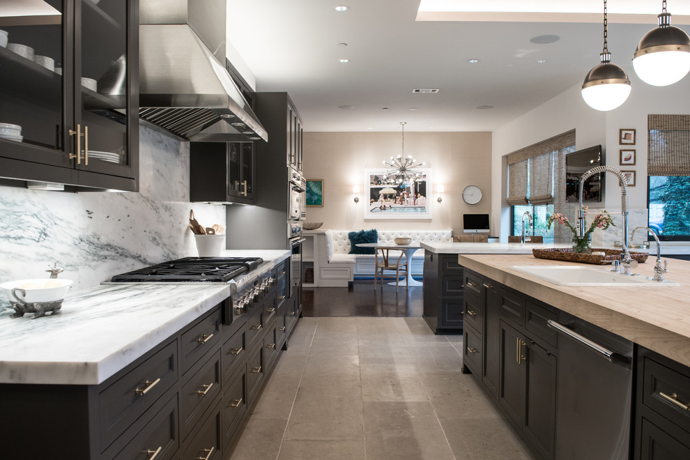This is an example of a large transitional l-shaped eat-in kitchen in Dallas with a drop-in sink, beaded inset cabinets, grey cabinets, marble benchtops, white splashback, limestone floors, with island, stone slab splashback, stainless steel appliances, grey floor, white benchtop and vaulted.