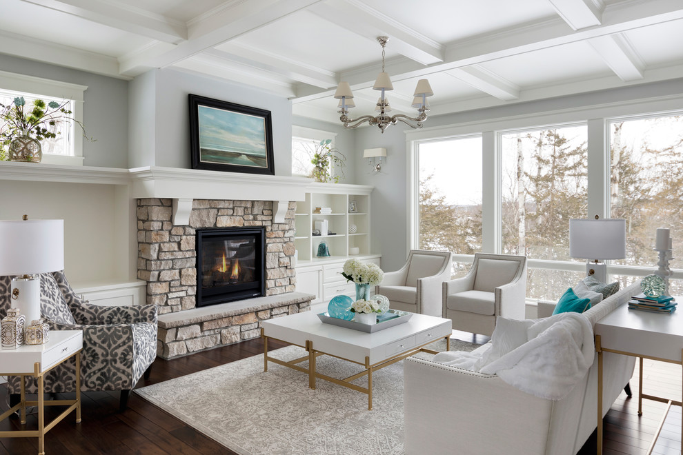 Design ideas for a large traditional formal living room in Other with grey walls, dark hardwood floors, a standard fireplace and a stone fireplace surround.