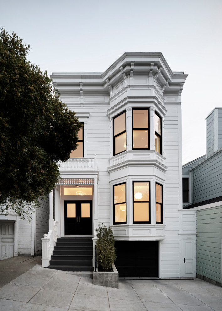 Inspiration for a victorian white three-story wood and clapboard house exterior remodel in San Francisco