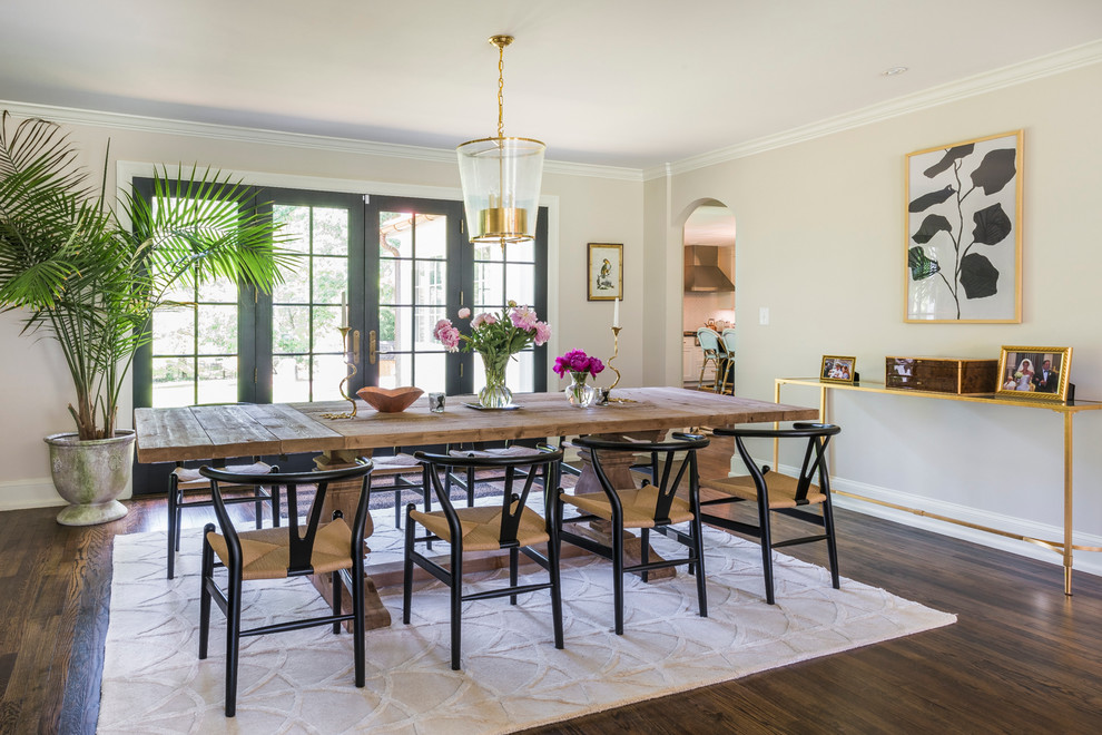 This is an example of a large transitional dining room in Philadelphia with beige walls and dark hardwood floors.