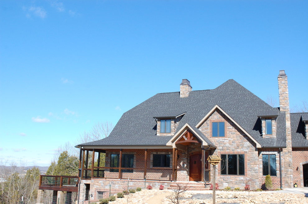Mountain style brown three-story brick exterior home photo
